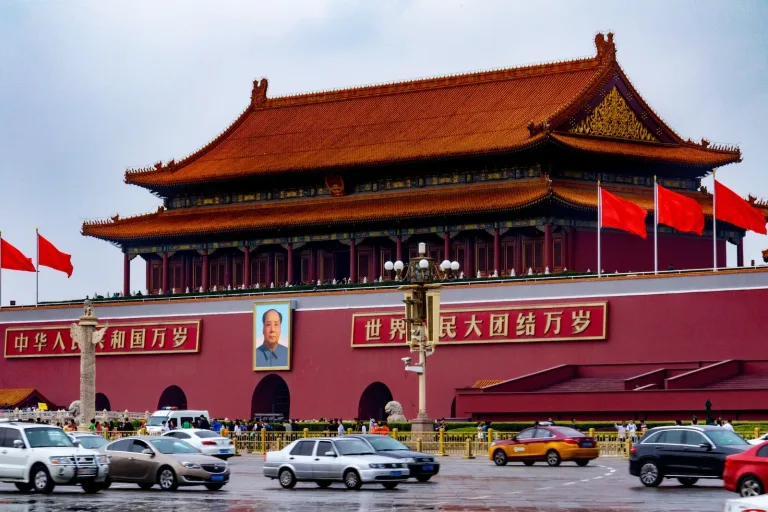 cars parked in front of Forbidden City Beijing