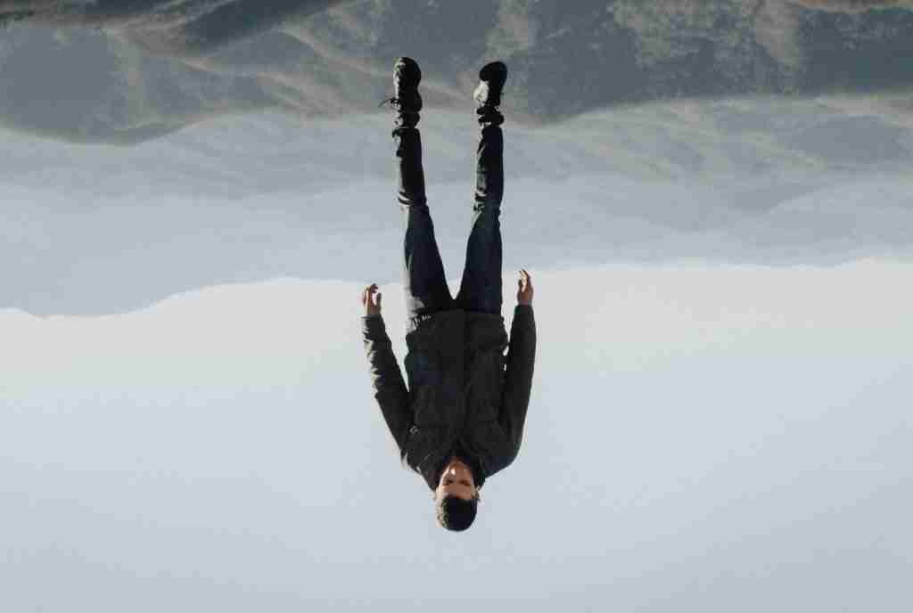 man floating above mountain