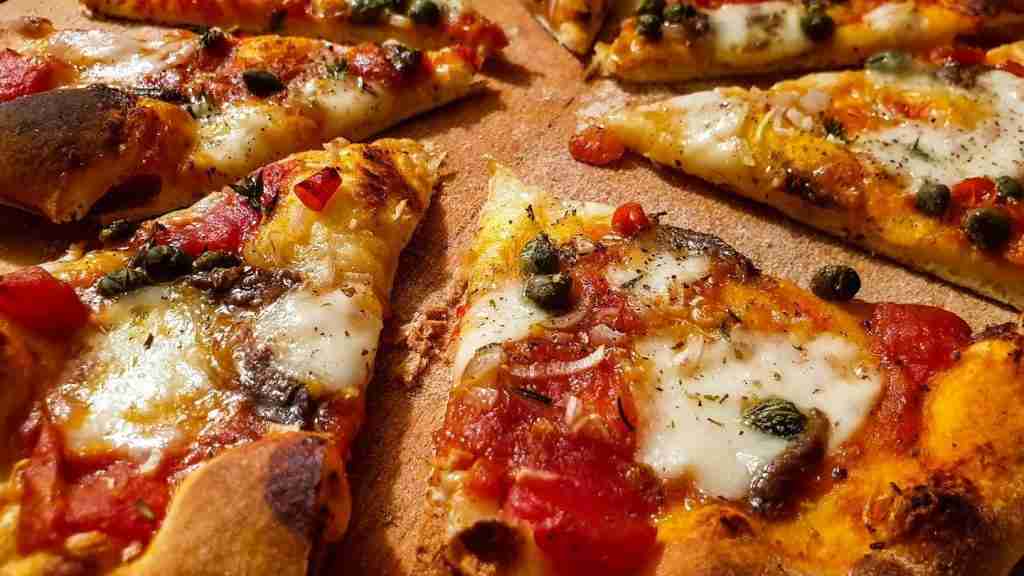 pizza with cheese and green leaves : Fun Facts About Pizza Hut