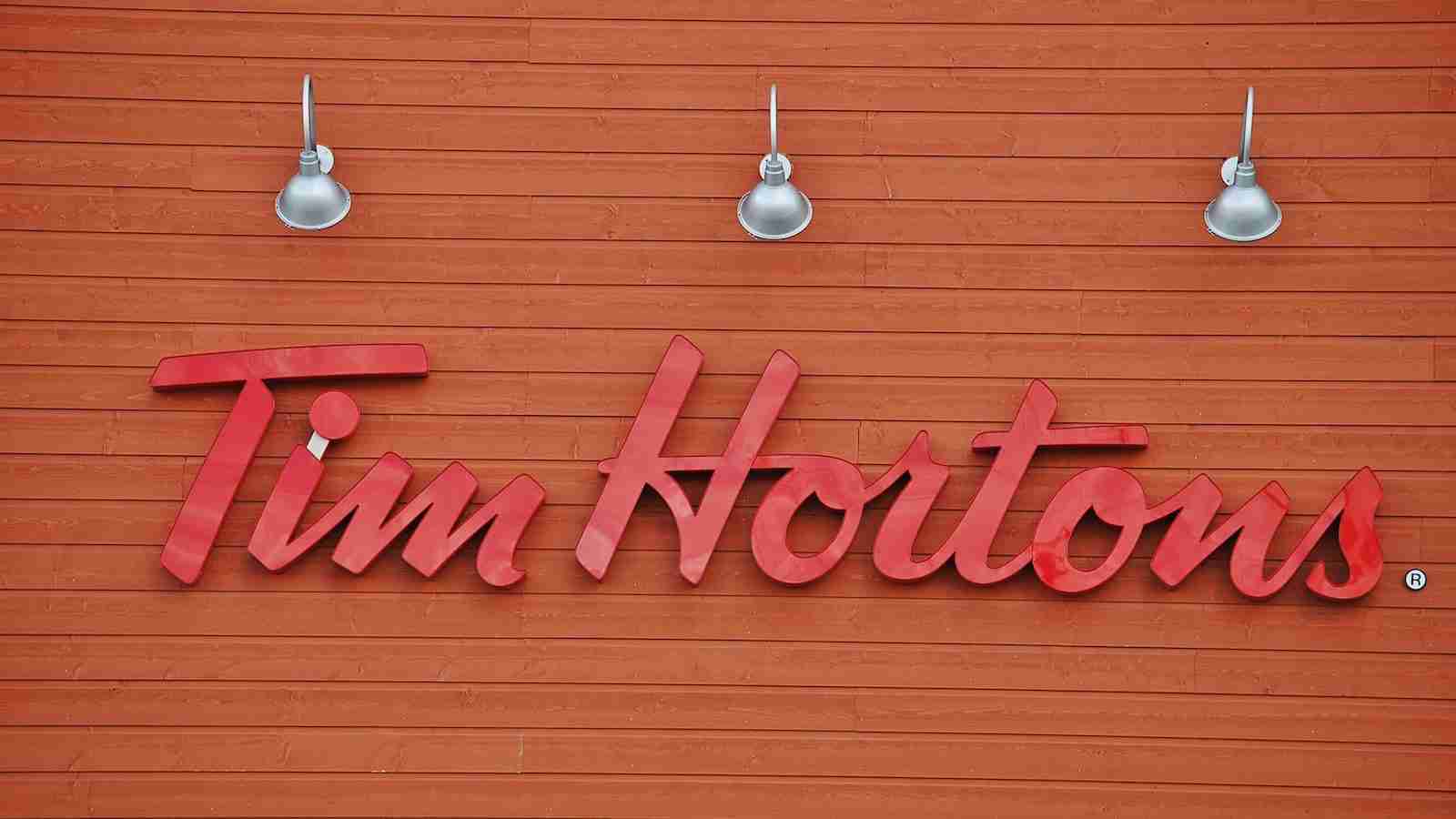 Tim Hortons signage under three gray lights