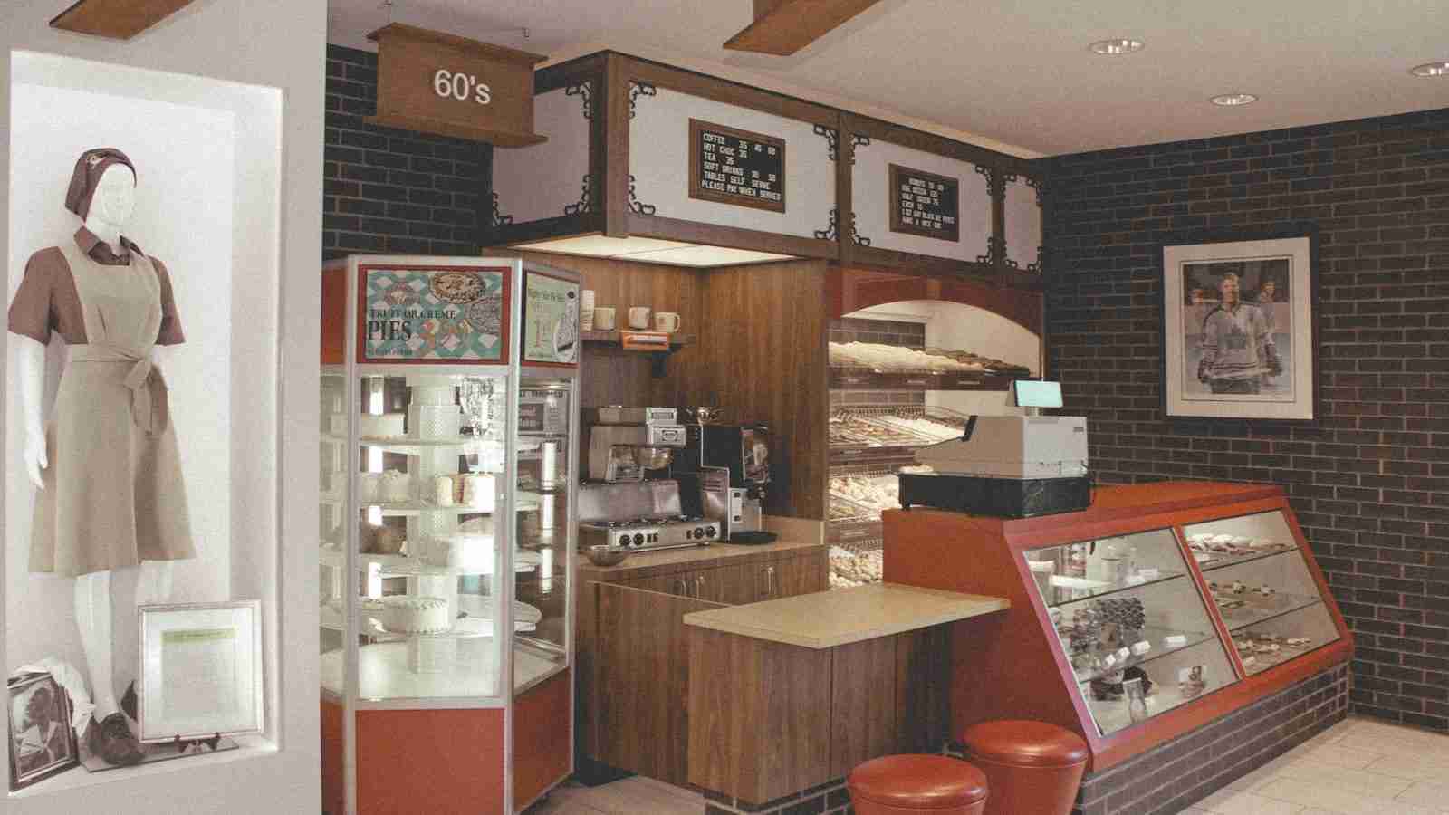 red and black bar stools beside brown wooden counter