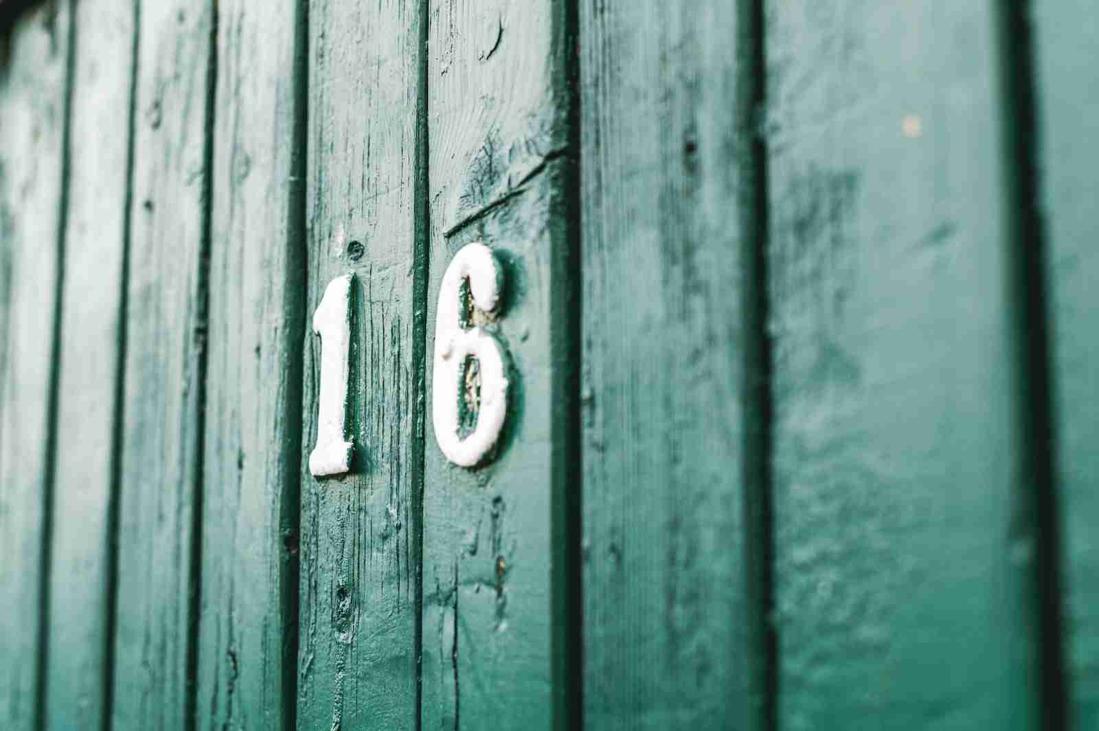 Photo of Number 16 on Green Wooden Wall