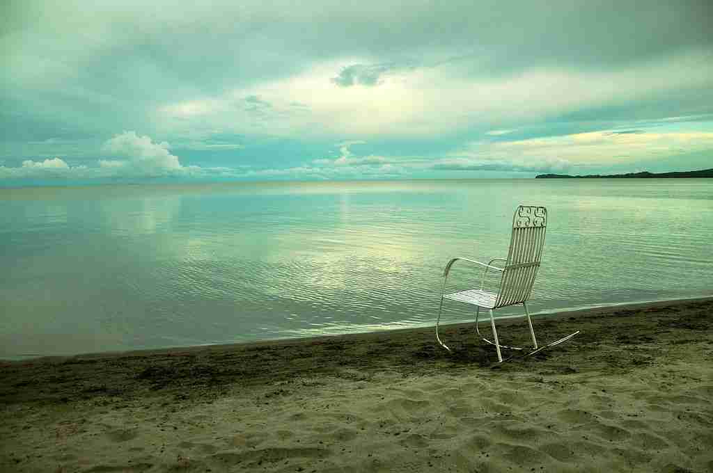 chair on a side of lake