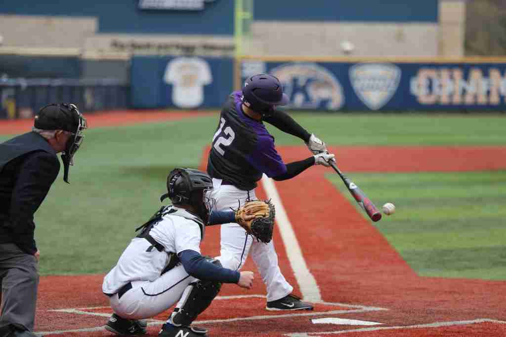 player swinging bat