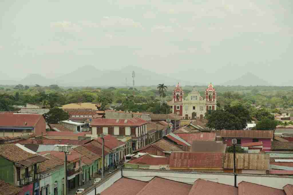 a view of a city with a church in the background