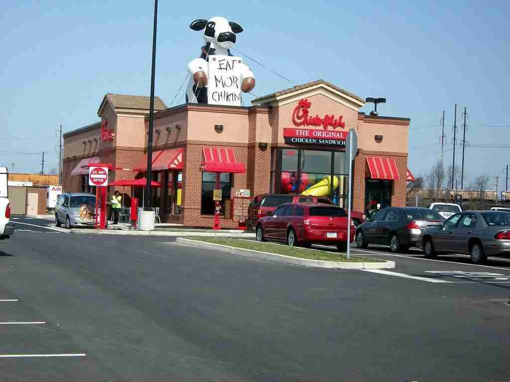 a building and some car in front : Fun Facts About Chick-fil-A