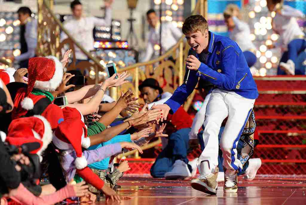 Justin Bieber singing in front of huge crowd