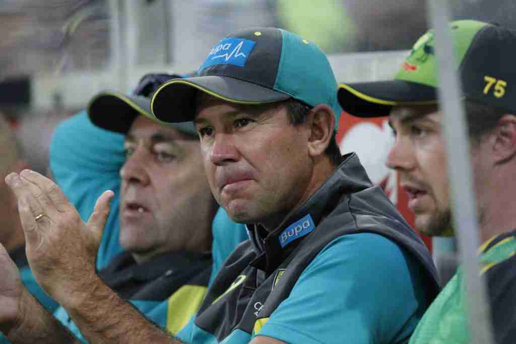 Ricky Ponting and some other cricket players sitting on a bench. 