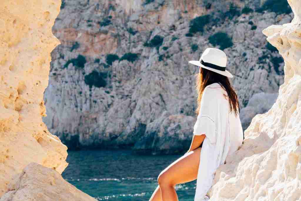 Rear View of Woman Sitting on a rock : Fun Facts About Summer