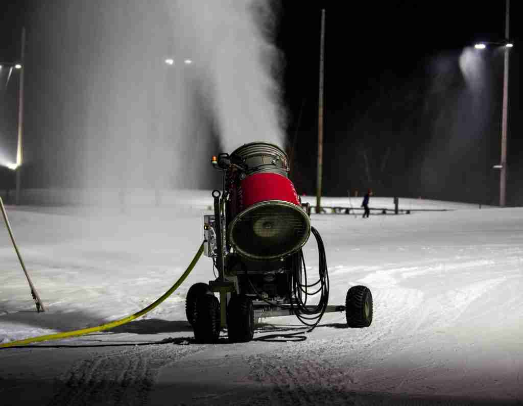 a snow blower is spraying snow on the ground : Fun Facts About Snow