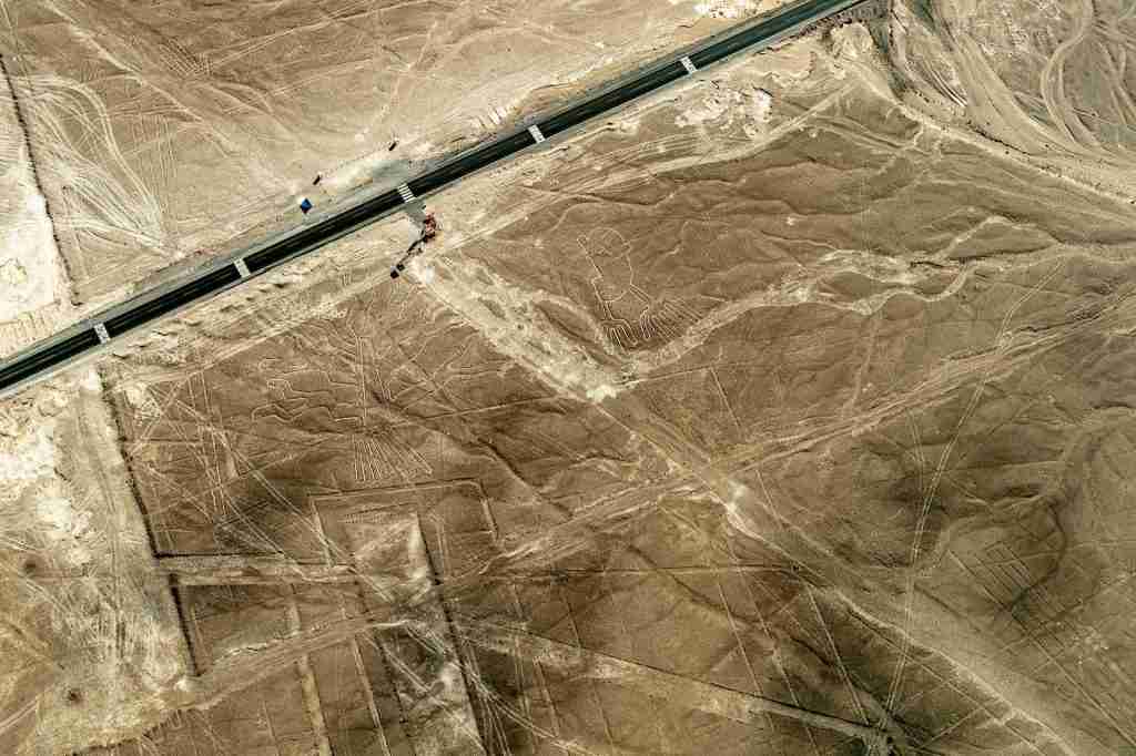 an aerial view of a highway in the desert