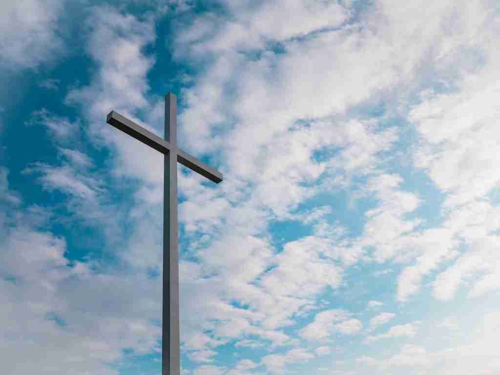 landscape shot of white cross during daytime