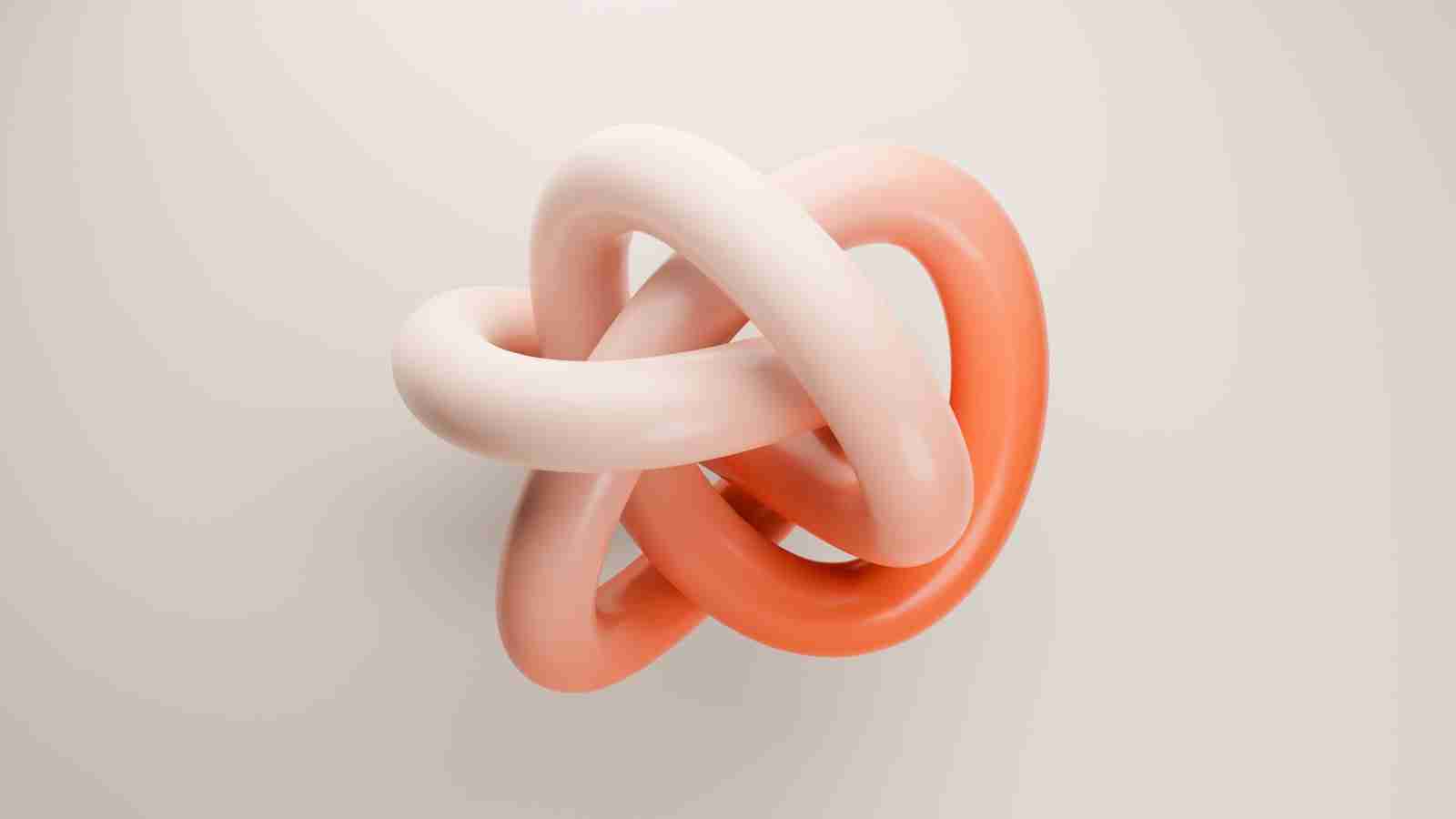 an orange and white knot on a white wall