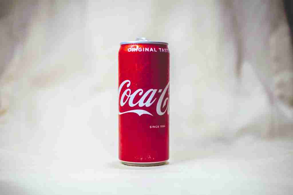 coca cola can on white table