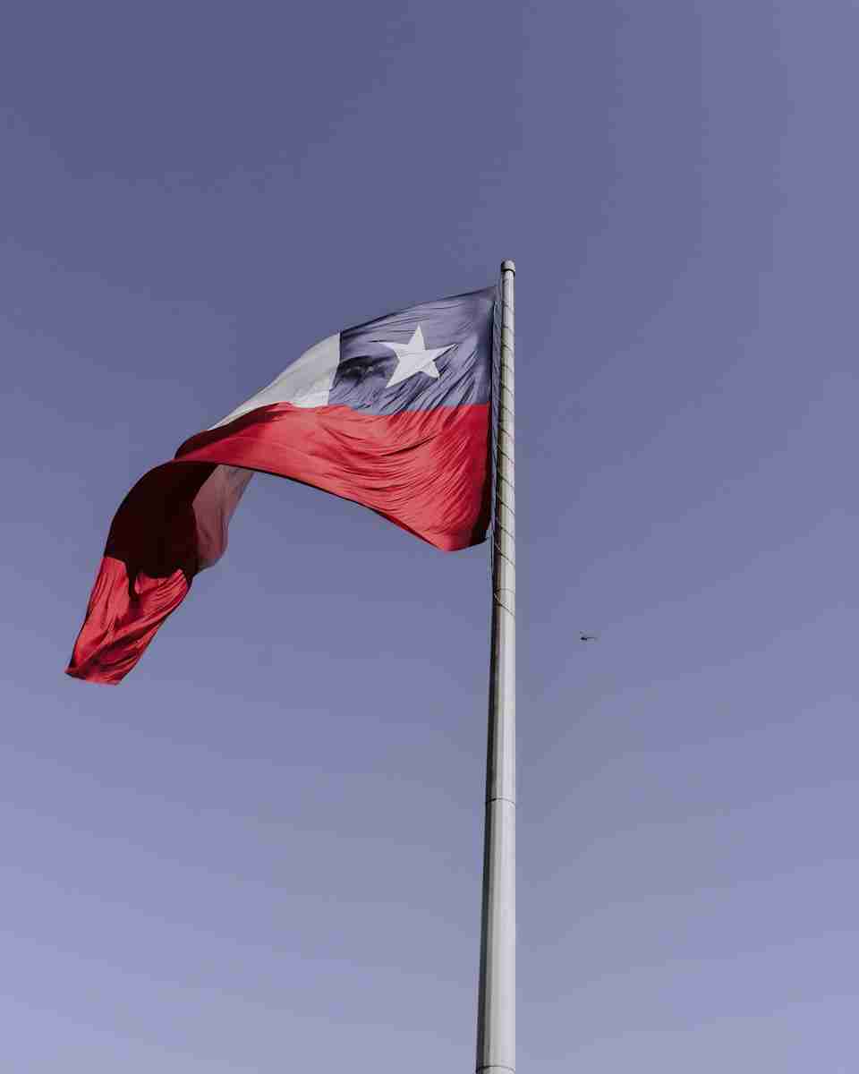 red and white flag on pole during daytime