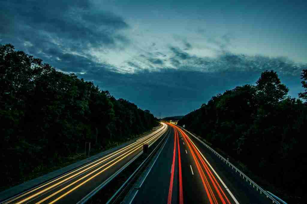 Time lapse photography of northbound and southbound lane with interesting facts about the speed of light.